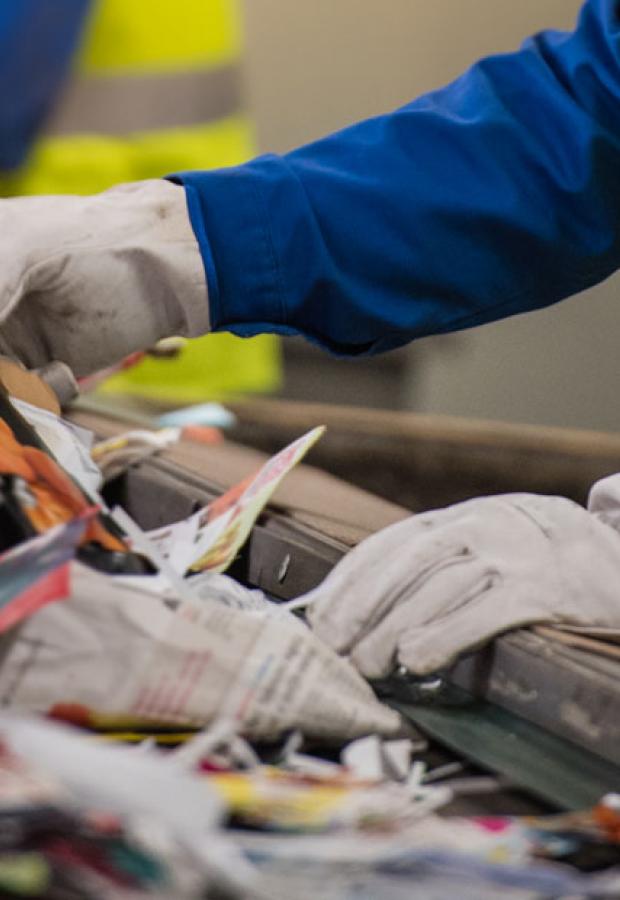 Operatives sorting recycling on a conveyor belt