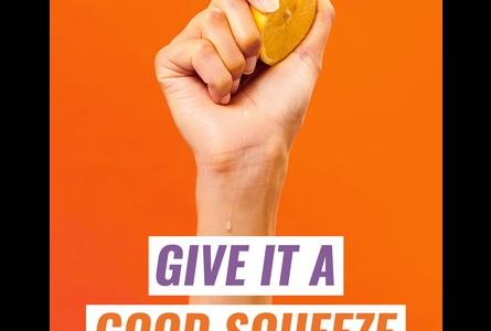 Give it a good squeeze social media asset, hand squeezing orange